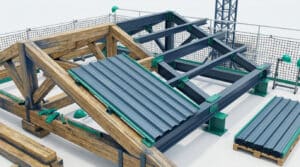 Vue en plongée d'une charpente hybride bois et métal en construction, avec des panneaux en bac acier posés.